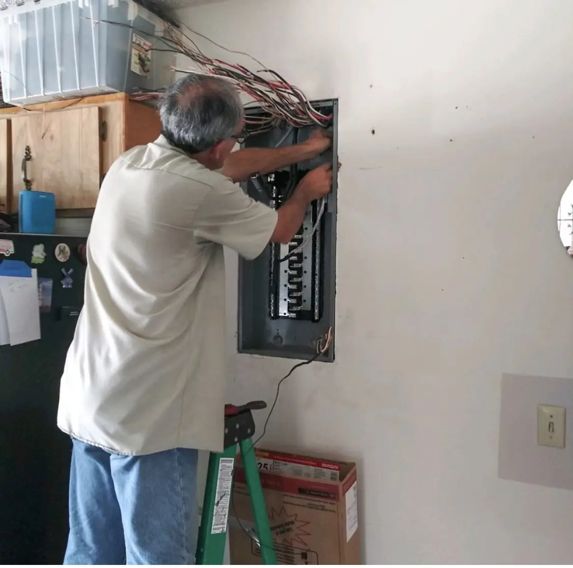 Technician inspecting an electrical panel