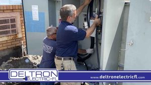 Electricians Installing New Electrical Panel