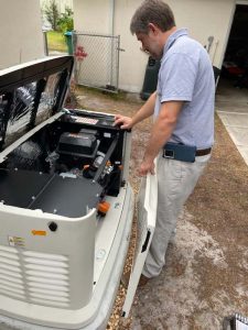 technician inspecting a standby generator