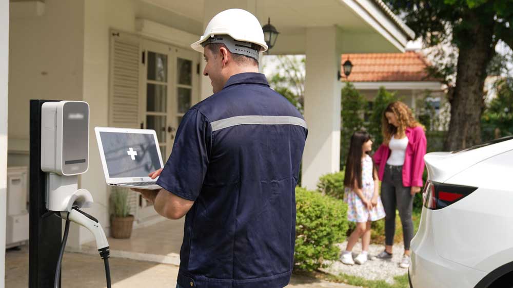 Deltron technician installing an EV charger in a garage