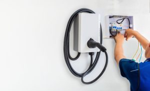 technician installing an EV charger