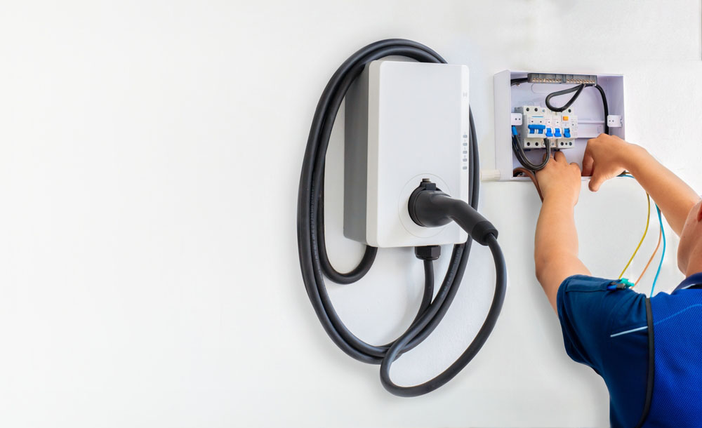 technician installing an EV charger